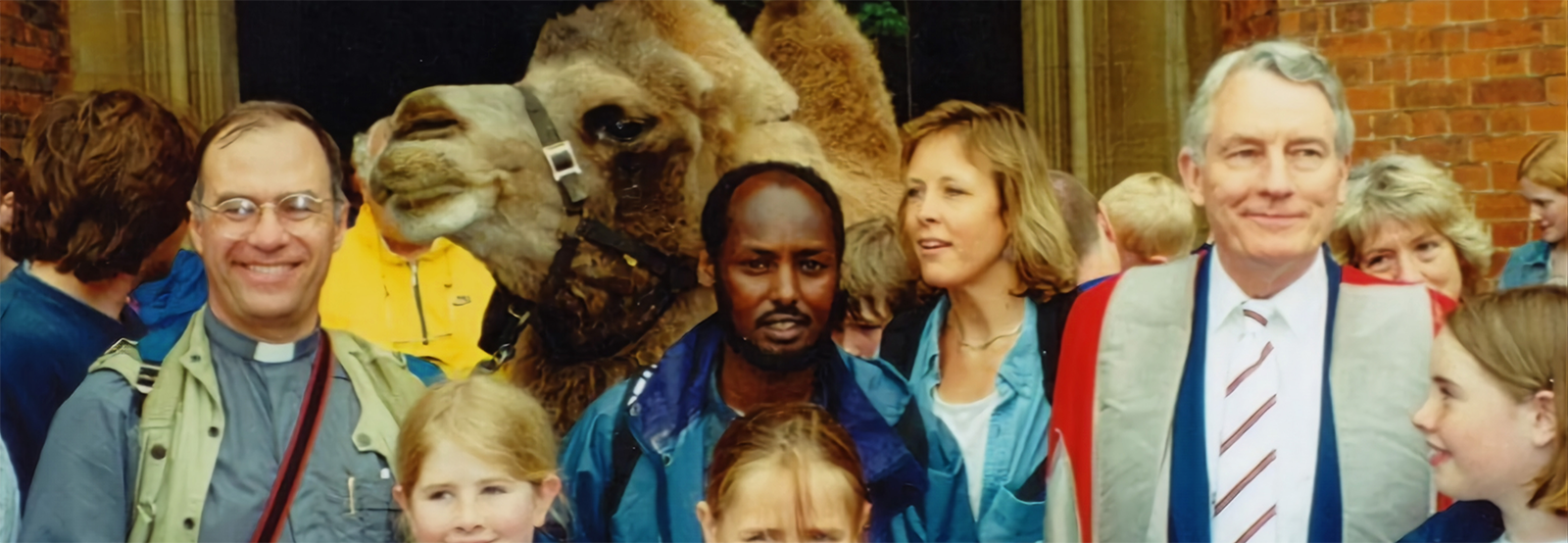 Sir David Harrison with Cleo the camel, who visited Selwyn in 1999.