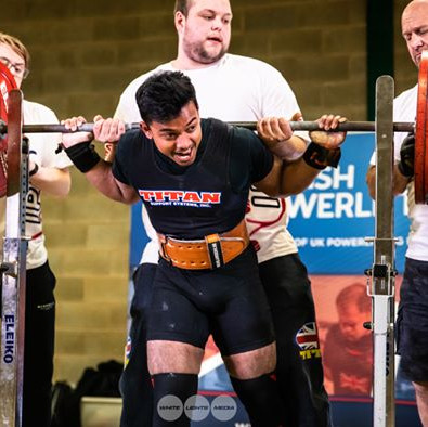 A student lifting weights in a competition