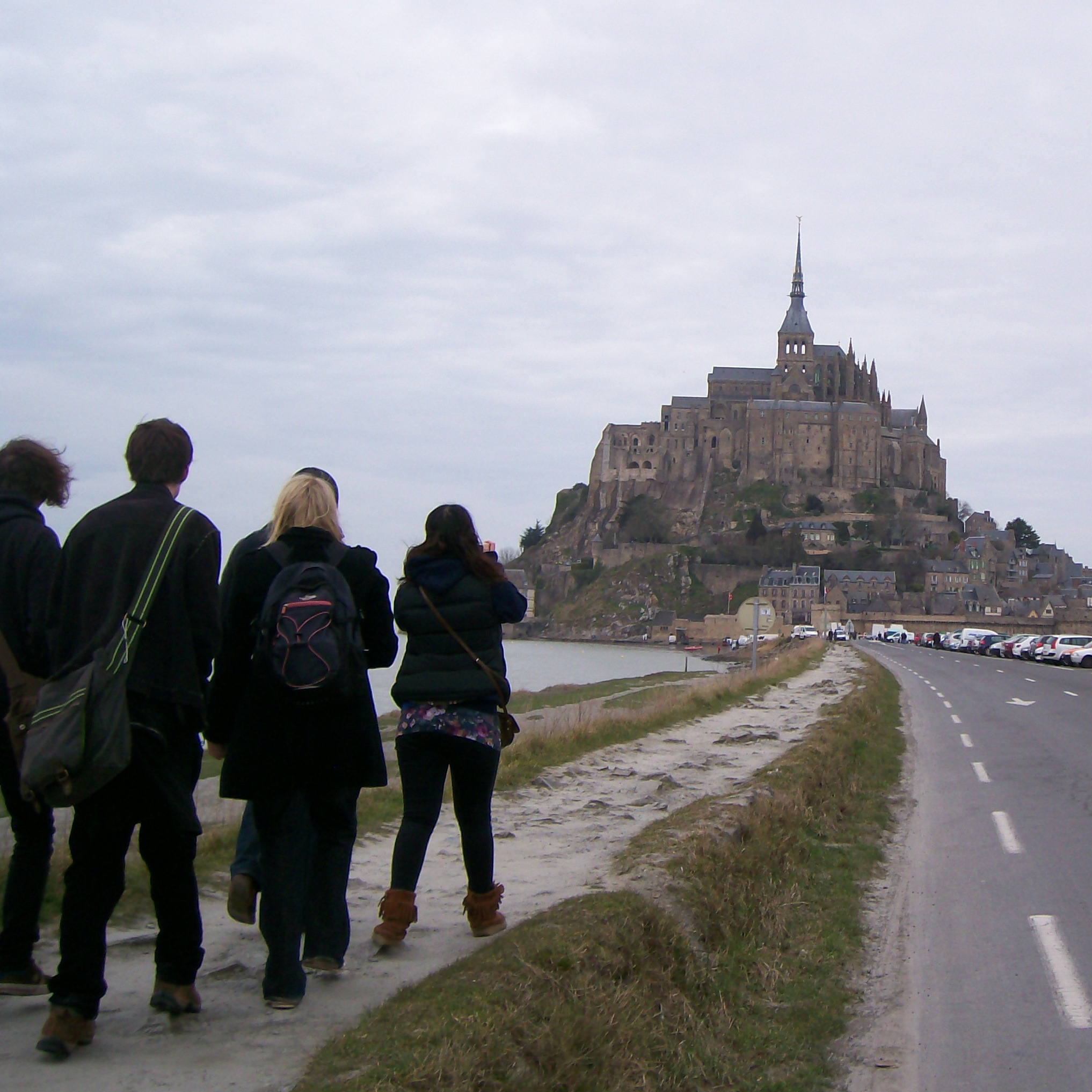 Archaeology students on a field trip, arriving at Mont St Michel