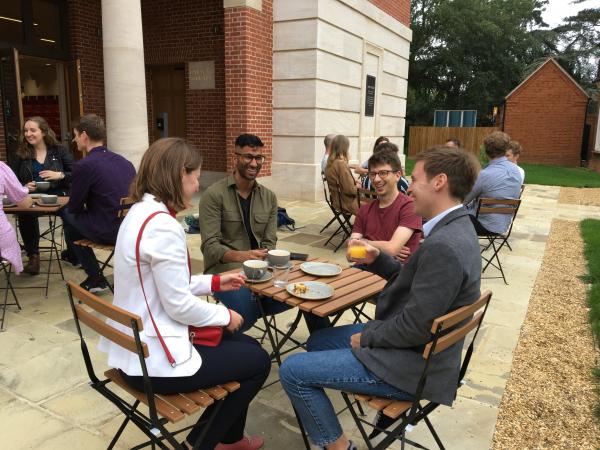 Attenders at the 10th anniversary reunion enjoying tea outside the new building